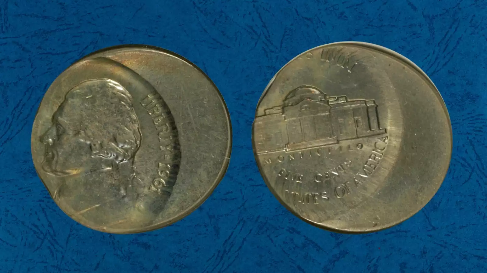 1961 proof nickel with off-center strike error showing blank crescent and partial design